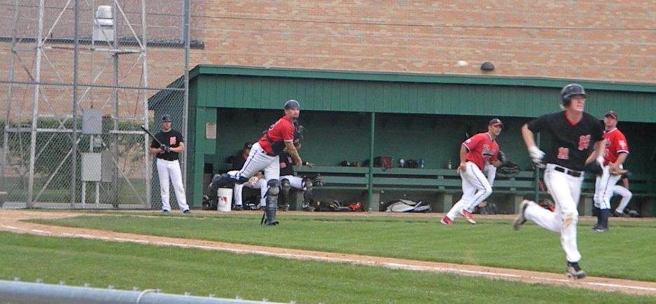 Pat Schultz throws out a Henderson baserunner